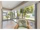 Enclosed patio shows views of the patio, landscaping and a peek at the side yard at 857 Enisgrove Way, The Villages, FL 32163