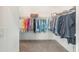 Walk-in closet with shelving and ample space for clothing storage at 857 Enisgrove Way, The Villages, FL 32163