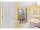 Bathroom with walk-in shower, toilet and vanity with sink at 917 Camino Del Rey Dr, The Villages, FL 32159