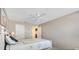 Relaxing bedroom with a ceiling fan and ample natural light and neutral tones at 917 Camino Del Rey Dr, The Villages, FL 32159