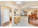 Open-concept view from kitchen to dining room at 917 Camino Del Rey Dr, The Villages, FL 32159
