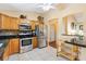Well-appointed kitchen featuring stainless steel appliances and granite countertops at 917 Camino Del Rey Dr, The Villages, FL 32159