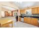 View of kitchen featuring stainless appliances, tile floors, and granite countertops at 917 Camino Del Rey Dr, The Villages, FL 32159