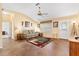 Cozy living room with tile floors, a comfortable sofa, and natural light streaming in at 917 Camino Del Rey Dr, The Villages, FL 32159
