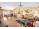 Open-concept living room and dining area featuring tile flooring and ample natural light at 917 Camino Del Rey Dr, The Villages, FL 32159