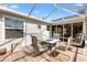Screened patio with outdoor furniture, ideal for enjoying the weather at 917 Camino Del Rey Dr, The Villages, FL 32159