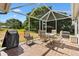 Outdoor patio area with a grill and seating, perfect for entertaining at 917 Camino Del Rey Dr, The Villages, FL 32159