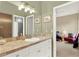 Well-lit bathroom with tiled countertop and decorative hardware at 9642 Bear Lake Rd, Apopka, FL 32703
