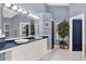 Elegant bathroom with a double vanity, decorative tile, and a spacious layout at 9642 Bear Lake Rd, Apopka, FL 32703