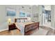 Bright bedroom featuring a vaulted ceiling, wooden furniture, and stylish coastal-themed artwork at 9642 Bear Lake Rd, Apopka, FL 32703