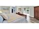 Serene bedroom with wood floors, a cozy bed, and access to a private balcony at 9642 Bear Lake Rd, Apopka, FL 32703