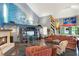 Bright living room with ocean themed mural, fireplace, and comfortable seating at 9642 Bear Lake Rd, Apopka, FL 32703