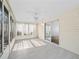 Inviting sunroom with tile floor and many windows offering natural light and serene views at 9757 Se 175Th Pl, Summerfield, FL 34491
