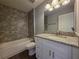 Bathroom with granite countertops, vanity, and tiled shower at 15010 Sw 29Th Ave Road, Ocala, FL 34473