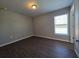 An empty bedroom featuring hard surface floors, a neutral color palette, and natural light at 15010 Sw 29Th Ave Road, Ocala, FL 34473