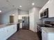 Modern kitchen features stainless steel appliances, granite countertops, and white cabinetry at 15010 Sw 29Th Ave Road, Ocala, FL 34473