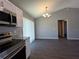 Modern kitchen with stainless steel appliances, granite countertops, and a dining area at 15010 Sw 29Th Ave Road, Ocala, FL 34473