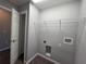 Convenient laundry room with overhead shelving and washer/dryer hookups at 15010 Sw 29Th Ave Road, Ocala, FL 34473