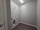 Convenient laundry room with overhead shelving and washer/dryer hookups at 15010 Sw 29Th Ave Road, Ocala, FL 34473