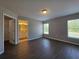 Spacious main bedroom featuring two windows and luxury vinyl plank flooring at 15010 Sw 29Th Ave Road, Ocala, FL 34473
