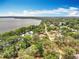 Beautiful aerial shot overlooking a residential area, showcasing lake views and serene neighborhood streets at 1001 N Lakeshore Blvd, Howey In The Hills, FL 34737