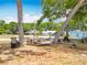 Inviting backyard setup with lounge chairs, hammock, and fire pit, perfect for outdoor gatherings at 1001 N Lakeshore Blvd, Howey In The Hills, FL 34737