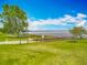 Beautiful waterfront park featuring a fishing pier on a picturesque lake with lush green surroundings at 1001 N Lakeshore Blvd, Howey In The Hills, FL 34737