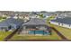 Aerial view of a screened-in pool and backyard, showcasing the home's privacy and outdoor amenities at 11362 Zimmerman Path, Oxford, FL 34484