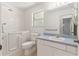 Bathroom with a walk-in bathtub, toilet, single sink vanity, and tiled floors at 1212 Chaparral Dr, Lady Lake, FL 32159
