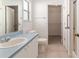 Bathroom featuring a white sink and vanity, tile floor, and walk in shower at 1212 Chaparral Dr, Lady Lake, FL 32159