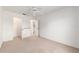 A bedroom featuring an adjacent walk-in closet and neutral carpet flooring at 1212 Chaparral Dr, Lady Lake, FL 32159