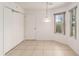 Bright dining area with tile flooring, large closets, and a charming light fixture at 1212 Chaparral Dr, Lady Lake, FL 32159
