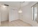 Tile dining area with large closet, neutral walls, and window view to outside at 1212 Chaparral Dr, Lady Lake, FL 32159