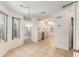 Dining area showcasing tile flooring, bright neutral walls, and view of the kitchen at 1212 Chaparral Dr, Lady Lake, FL 32159