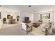 Bright, open floor plan featuring a living room connected to a dining area and kitchen at 1212 Chaparral Dr, Lady Lake, FL 32159