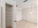 Pantry with shelving for optimal storage, adjacent to a tile floor dining area at 1212 Chaparral Dr, Lady Lake, FL 32159