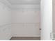 A walk-in closet with carpet flooring and wire shelving for optimal storage at 1212 Chaparral Dr, Lady Lake, FL 32159