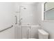 Comfortable walk-in tub featuring grab bars, adjustable shower head, and a window for natural light at 1212 Chaparral Dr, Lady Lake, FL 32159
