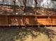 The backyard has a long, attractive wood retaining wall at 1307 Rain Forest Ln, Minneola, FL 34715