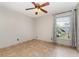 Bright bedroom with tile flooring, a window, and modern ceiling fan at 1307 Rain Forest Ln, Minneola, FL 34715
