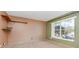 Neutral bedroom space with window, shelf and tiled floor, ready for personalization at 1307 Rain Forest Ln, Minneola, FL 34715
