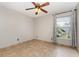 Bright bedroom featuring tile floor and large windows at 1307 Rain Forest Ln, Minneola, FL 34715