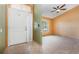 Welcoming entryway features neutral tones, tile flooring, and a decorative ceiling fan at 1307 Rain Forest Ln, Minneola, FL 34715