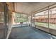 Enclosed patio featuring ample sunlight and views of the lush backyard and landscaping at 1307 Rain Forest Ln, Minneola, FL 34715