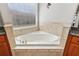 Bathroom close-up showing soaking tub with decorative tile at 13301 Biscayne Dr, Grand Island, FL 32735