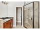 Bathroom featuring granite counter, double vanity, and glass shower at 13301 Biscayne Dr, Grand Island, FL 32735
