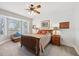 Comfortable bedroom with white shiplap wall, bay window, and wood furniture at 13301 Biscayne Dr, Grand Island, FL 32735