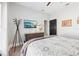 Bright bedroom with a queen bed, a mounted TV, and soft carpet at 13301 Biscayne Dr, Grand Island, FL 32735