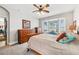 Charming bedroom with bay window, ceiling fan, and carpet floors at 13301 Biscayne Dr, Grand Island, FL 32735