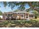 Charming single-story home with well-manicured lawn and inviting double-door entrance at 13301 Biscayne Dr, Grand Island, FL 32735